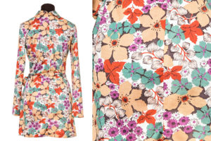 Colour image of a floral mini dress with close up of the red green beige and purple pattern on the right.