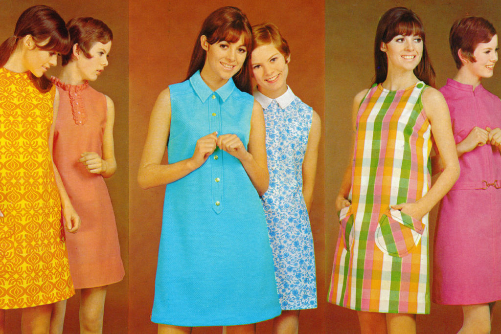 Colour image of models in mini dresses.