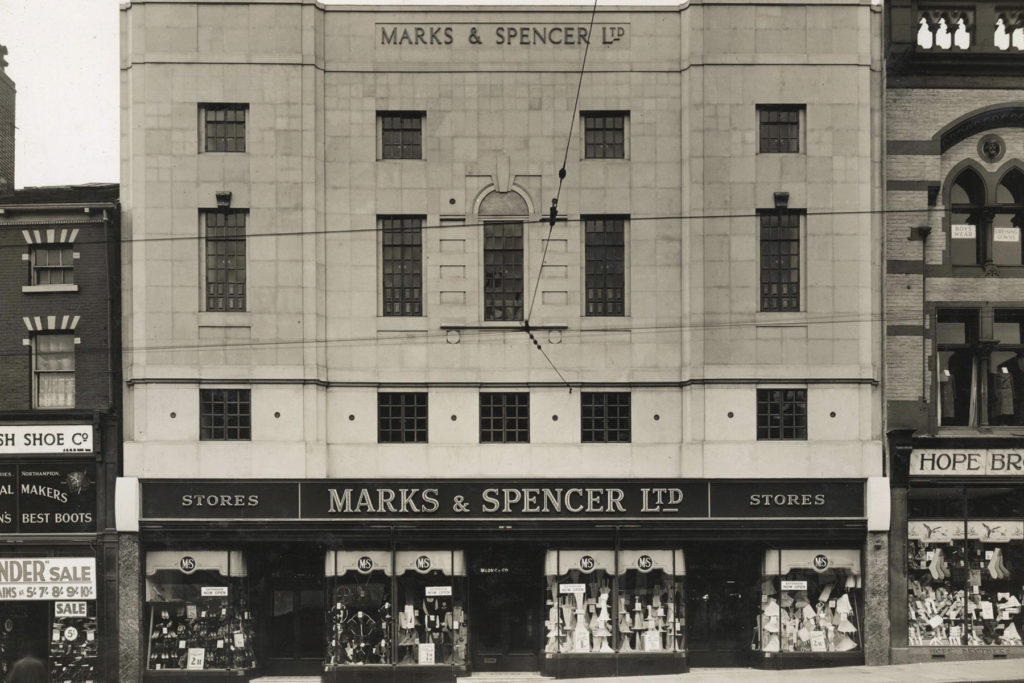 A black and white image of an M&S store.
