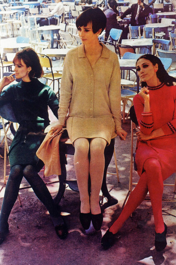 Colour image of three female models in knitwear.