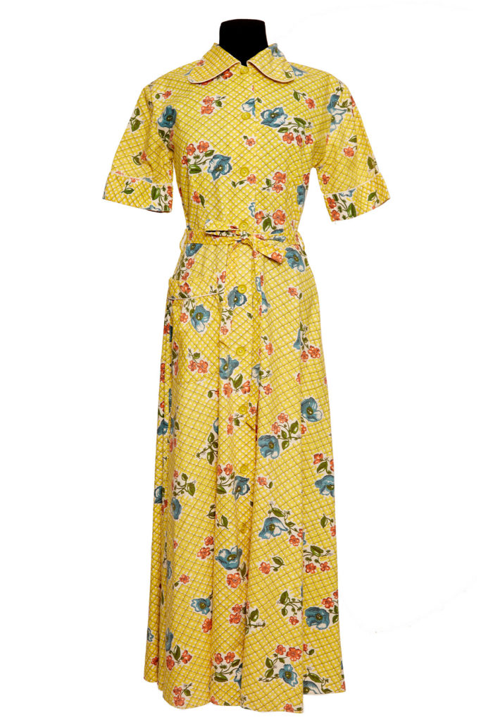 Colour image of a long yellow housecoat dress