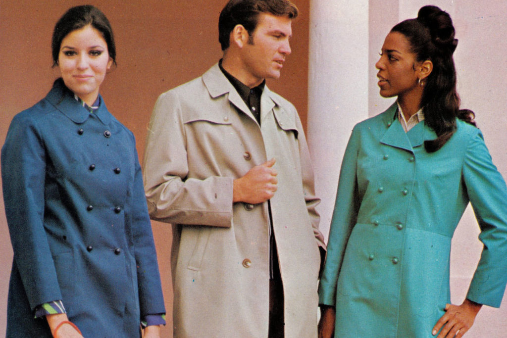 Colour image of three models wearing raincoats