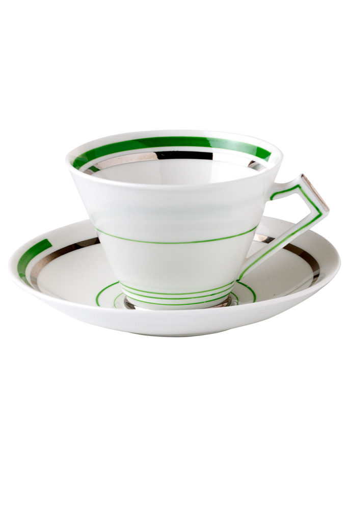 Colour image of a cup and saucer with a green and silver art deco design