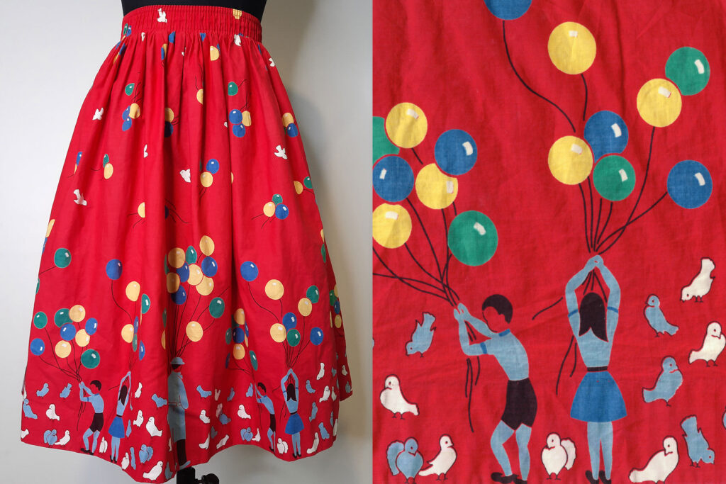 Colour image of a child's skirt on a mannequin with a close up of the print on the right. The print is a red background with illustrations of children and adults playing with green, yellow and blue balloons, along with pigeons.