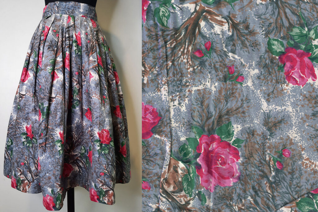 Colour image of a grey skirt on a mannequin, with a close up of the print on the right. The print is a grey and white background with pink flowers and green foliage.