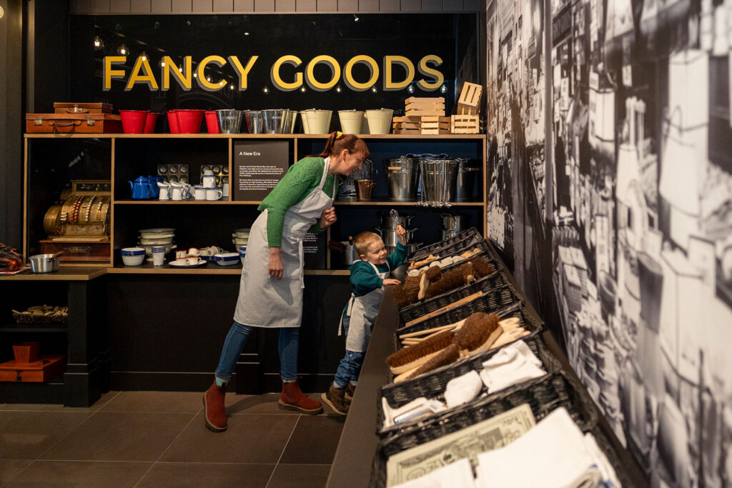 Colour photo of a parent and child in a replica shop
