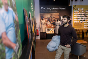 Colour image of a man looking at a museum display